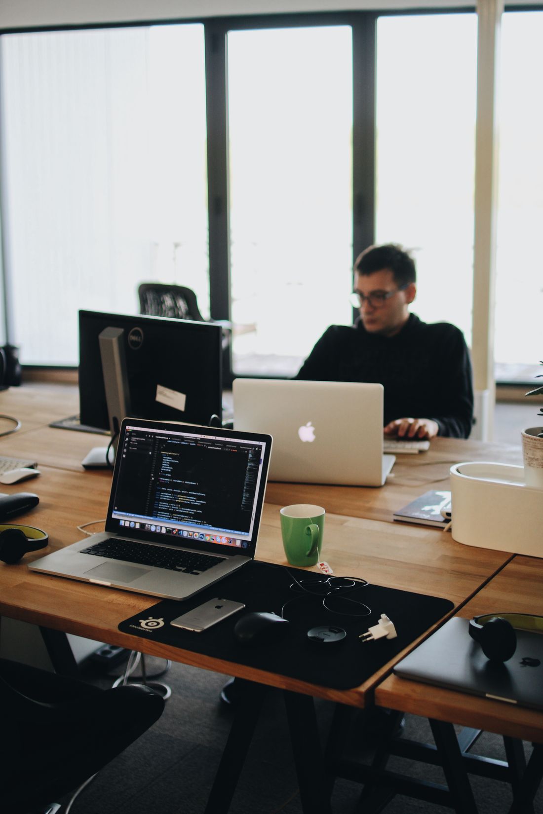 Developers building a custom website on their laptops