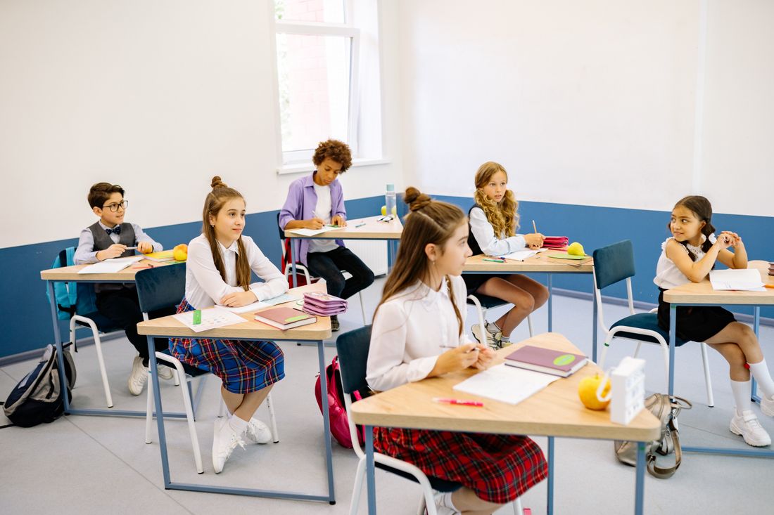 Students working at desks in a classroom